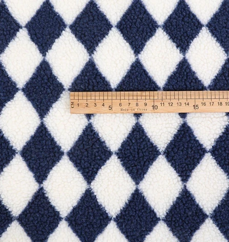 Den ene sidetrykk Sherpa Fleece -stoffet til plagg